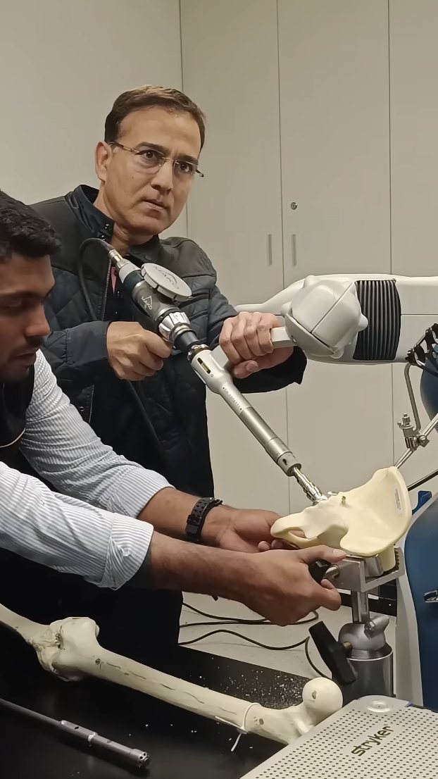 Dr. Ashwani Maichand performing robotic-assisted hip replacement